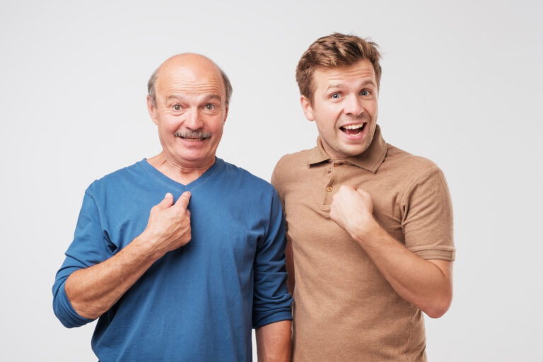 Two shocked, surprised, mature men looking asking question, you talking to me, you mean me. Select me please concept.